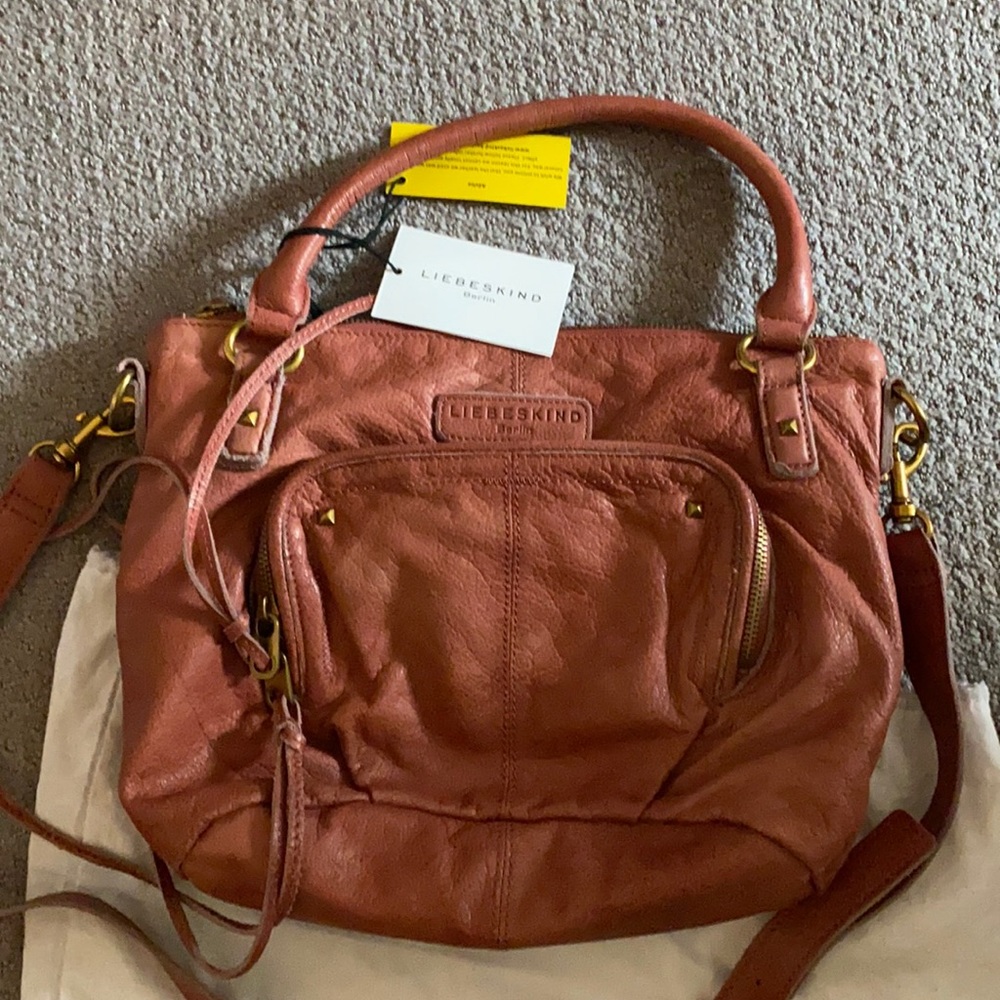 Liebeskind crossbody with adjustable straps.